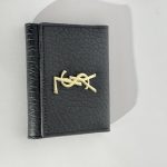 Elegant black Goyard women's wallet with gold logo.