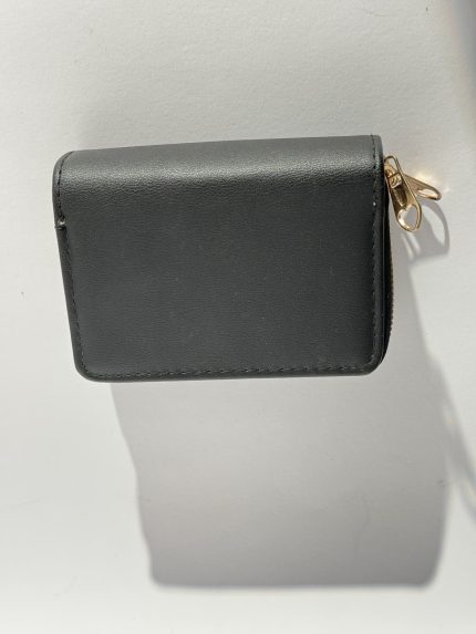 Elegant women's wallet with gold zipper on white background.