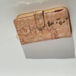 Elegant women's wallet with vintage map design.