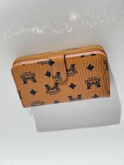 Elegant women's wallet with logo pattern and zip closure.
