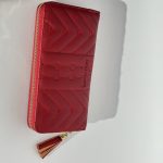 Red Portofol Forever Young femrash wallet with tassel zipper.