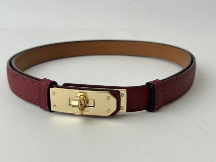 Luxury Hermes Kelly leather belt with gold buckle.