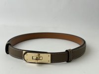 Hermes Kelly leather belt with gold buckle, elegant fashion accessory.