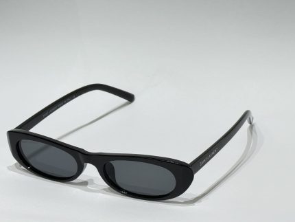 Black women's sunglasses with sleek design on white background.