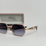 YSL women's sunglasses with gold frame and gradient lenses.