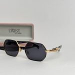 Prada women's sunglasses with gold frame and black lenses.
