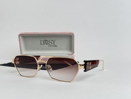 Saint Laurent women's sunglasses with gold frame and gradient lenses.