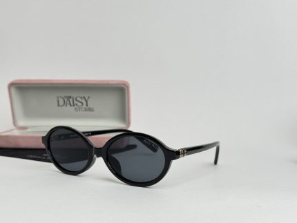 Black YSL women's sunglasses with case, stylish and elegant design.