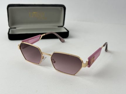 Pink Tom Ford women's sunglasses with gold frame and case.