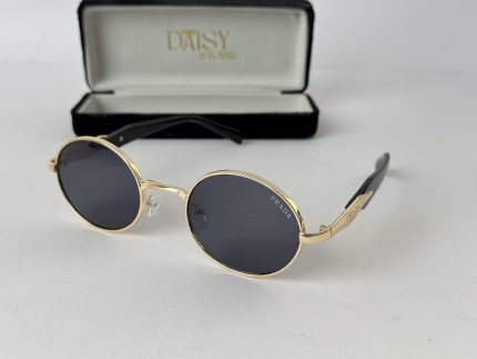 Round Gucci sunglasses for women with gold frame.
