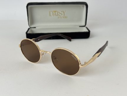 Elegant Celine women's sunglasses with gold frames and brown lenses.
