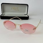 Pink Gucci women's sunglasses with gold frame and case.
