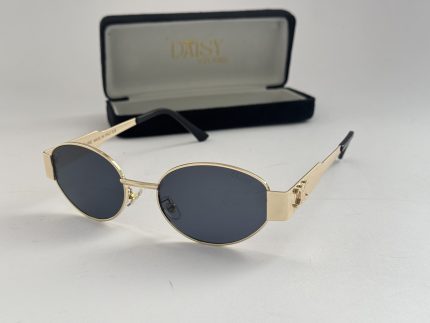 Gucci women's sunglasses with gold frame and dark lenses.