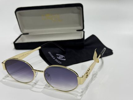 Loewe women's sunglasses with case and cloth, elegant gold frame.