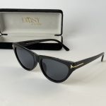Prada women's sunglasses with black frame and case.