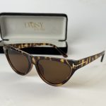 Miu Miu women's sunglasses, tortoiseshell frame, elegant protection.