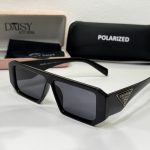 Black rectangular sunglasses with case, labeled Prada and polarized.