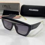 Prada women's sunglasses with black frame and polarized lenses.