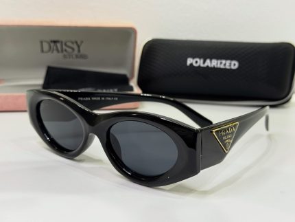 Prada women's sunglasses, elegant black design with protective polarized lenses.