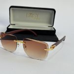 Men's sunglasses with gold accents and gradient lenses, stylish protective eyewear.