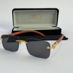 Men's sunglasses with gold accents and wooden arms in case.