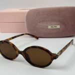 Miu Miu women's sunglasses with case and box displayed.
