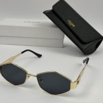 Celine women's sunglasses with case and box, elegant gold frame.