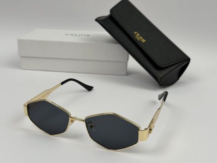 Celine women's sunglasses with case and box, elegant gold frame.