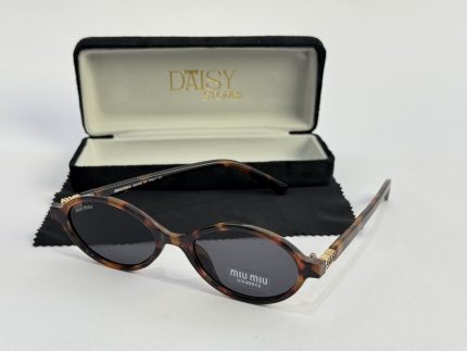 Miu Miu women's sunglasses with case, tortoiseshell frame.
