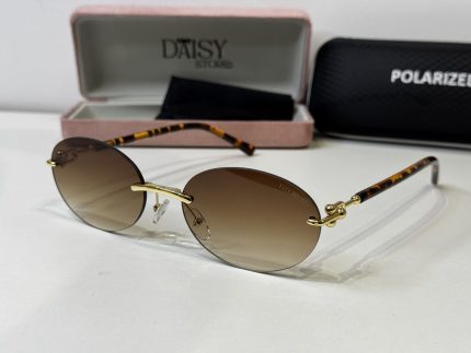 Tiffany & Co. sunglasses with case, gold accents, tortoiseshell arms.