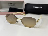 Tiffany & Co. sunglasses with gold accents, polarized lenses.