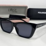 Saint Laurent women's sunglasses with case, black frame, polarized lenses.