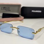 Elegant Cartier women's sunglasses with blue lenses and gold accents.