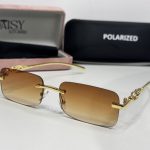 Elegant Cartier women's sunglasses with gold accents and polarized lenses.