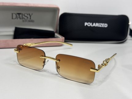 Elegant Cartier women's sunglasses with gold accents and polarized lenses.
