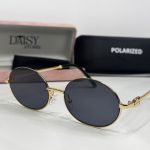 Women's sunglasses with gold frame and polarized lenses.