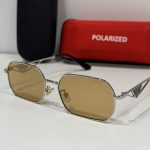 Prada women's sunglasses with polarized lenses and stylish case.