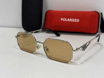 Prada women's sunglasses with polarized lenses and stylish case.