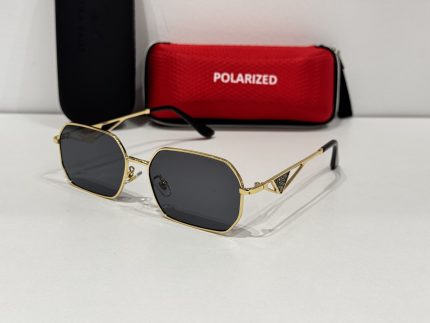 Prada women's sunglasses with gold frame and polarized lenses.
