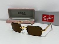 Ray-Ban sunglasses with gold frame, stylish and protective design.