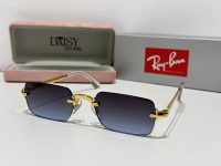 Ray-Ban sunglasses with gold frame and gradient lenses.