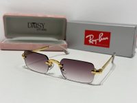 Ray-Ban sunglasses with gold accents, stylish protective eyewear.