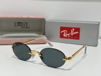 Ray-Ban sunglasses with gold frame and black lenses displayed in case.