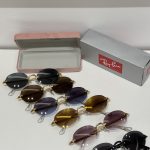 Ray-Ban sunglasses collection with protective case and box displayed.