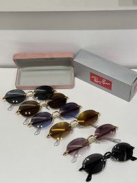 Ray-Ban sunglasses collection with protective case and box displayed.