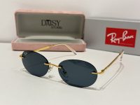 Ray-Ban sunglasses with gold frame and dark lenses, stylish and protective.