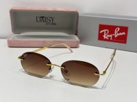 Ray-Ban sunglasses with gold frame and brown lenses, stylish and protective.