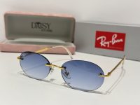 Ray-Ban sunglasses with blue lenses and gold frames in case.