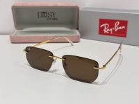 Ray-Ban sunglasses with gold frame and brown lenses displayed in case.