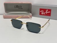 Ray-Ban sunglasses with gold frames and dark lenses, stylish protection.